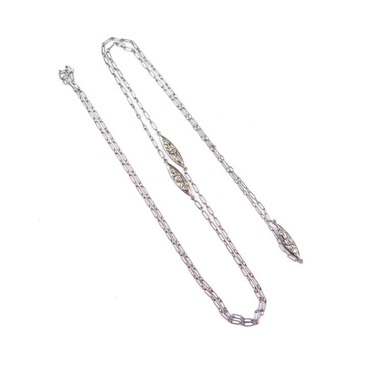 Platinum fetter link long chain necklace spaced by three diamond set cluster links